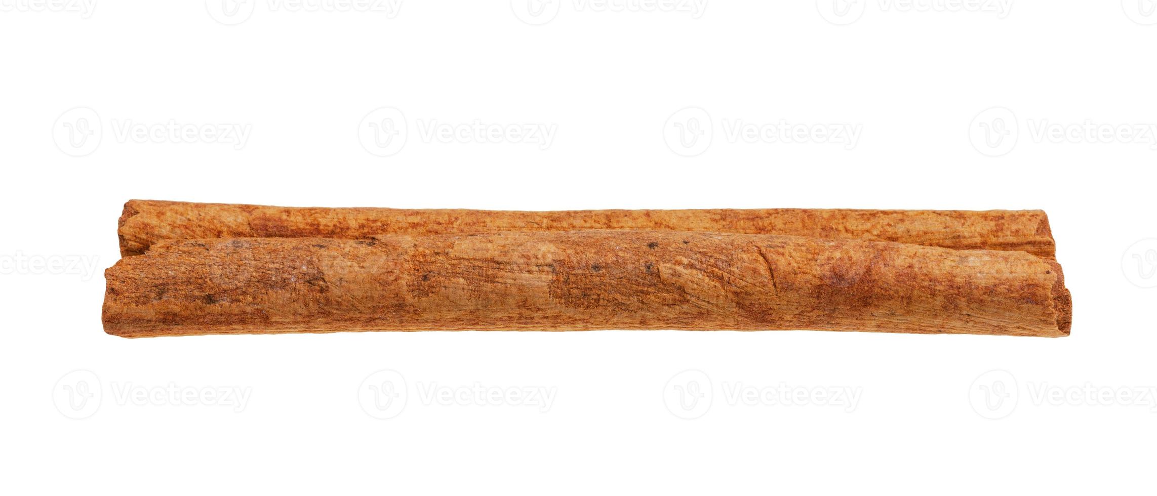 dried brown rolled Cinnamon stick isolated photo