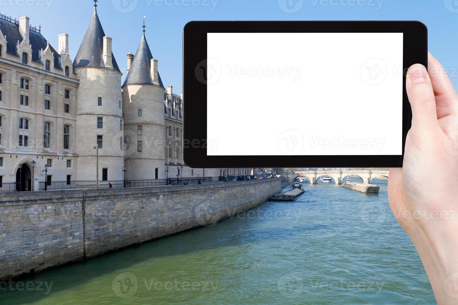 tourist photographs Conciergerie palace in Paris photo