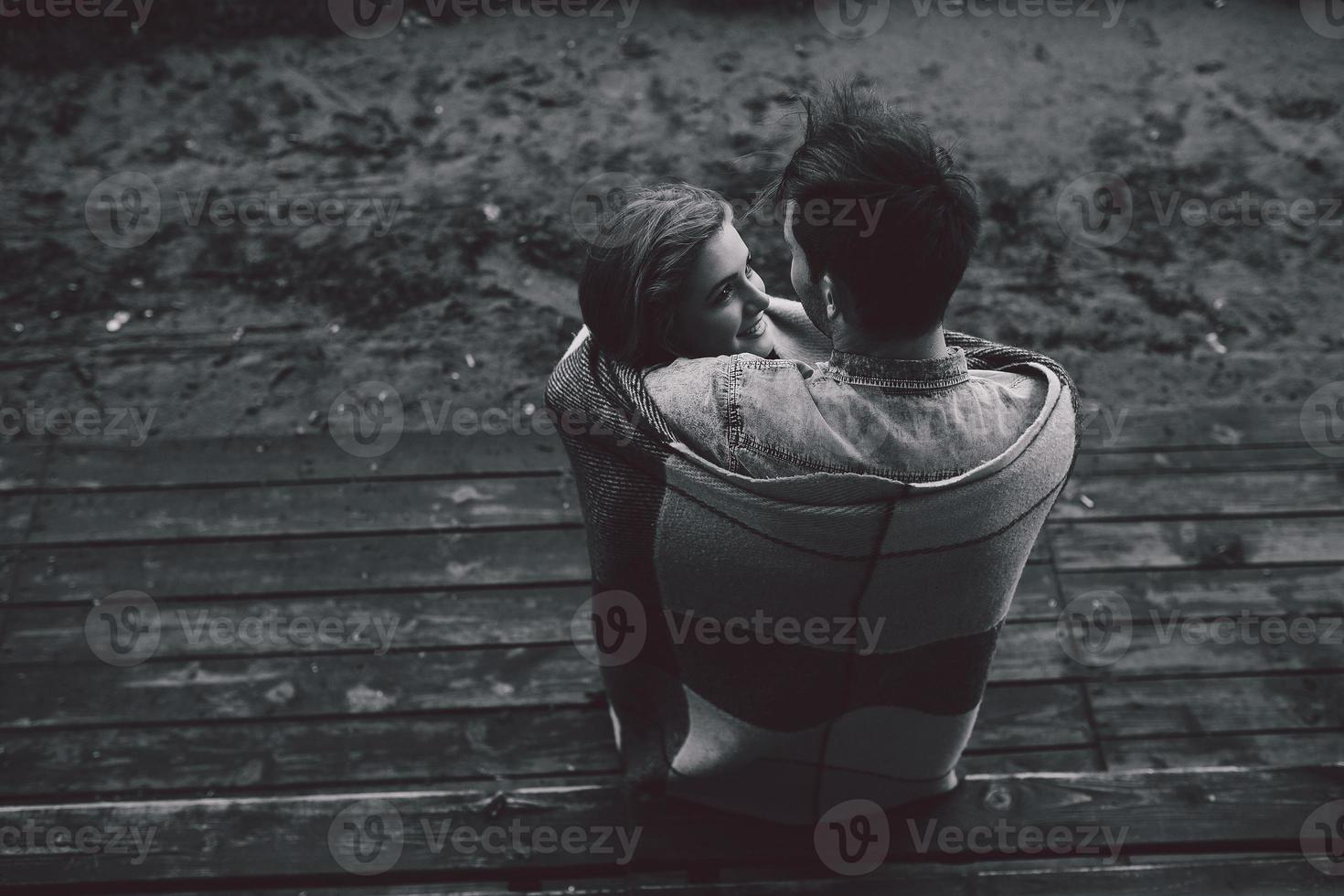 Young couple wrapped in plaid photo