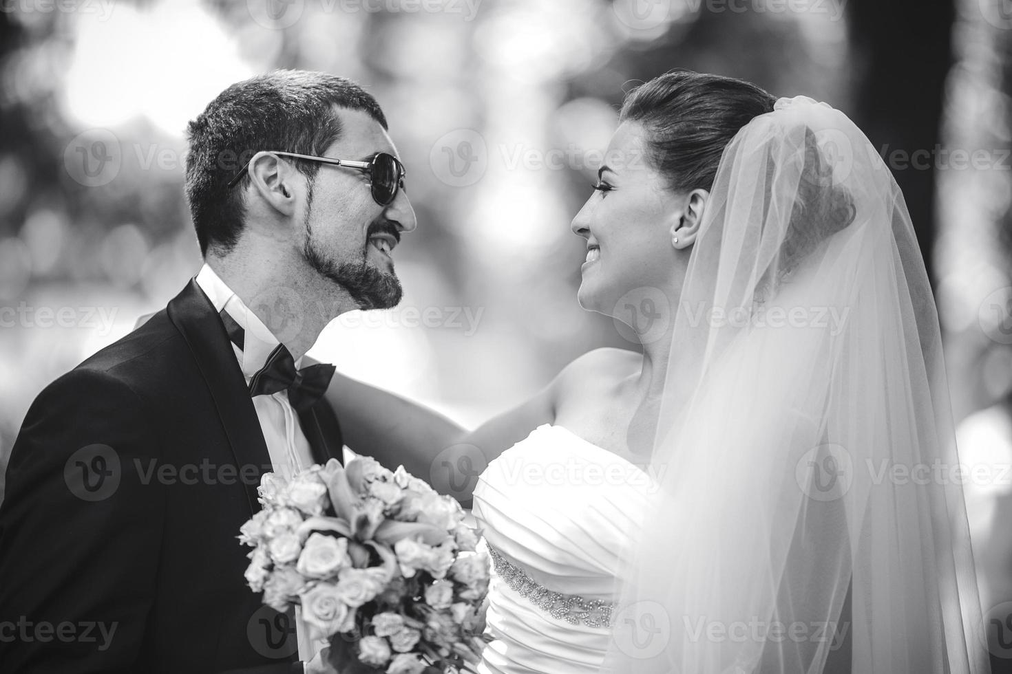 bride and groom look at each other photo