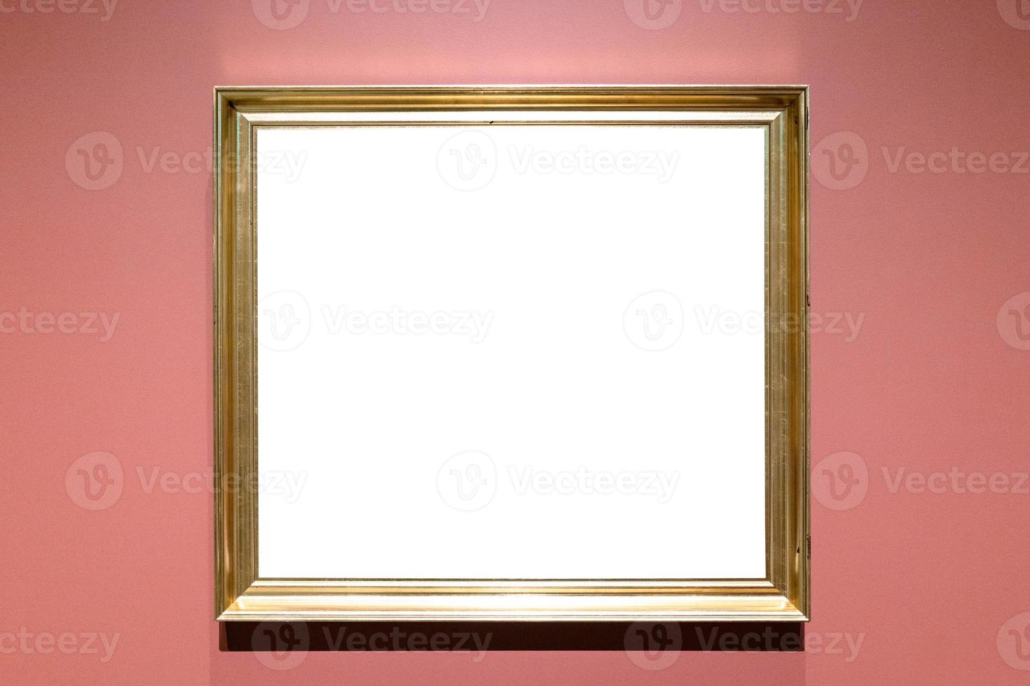 classical golden picture frame on pink wall photo