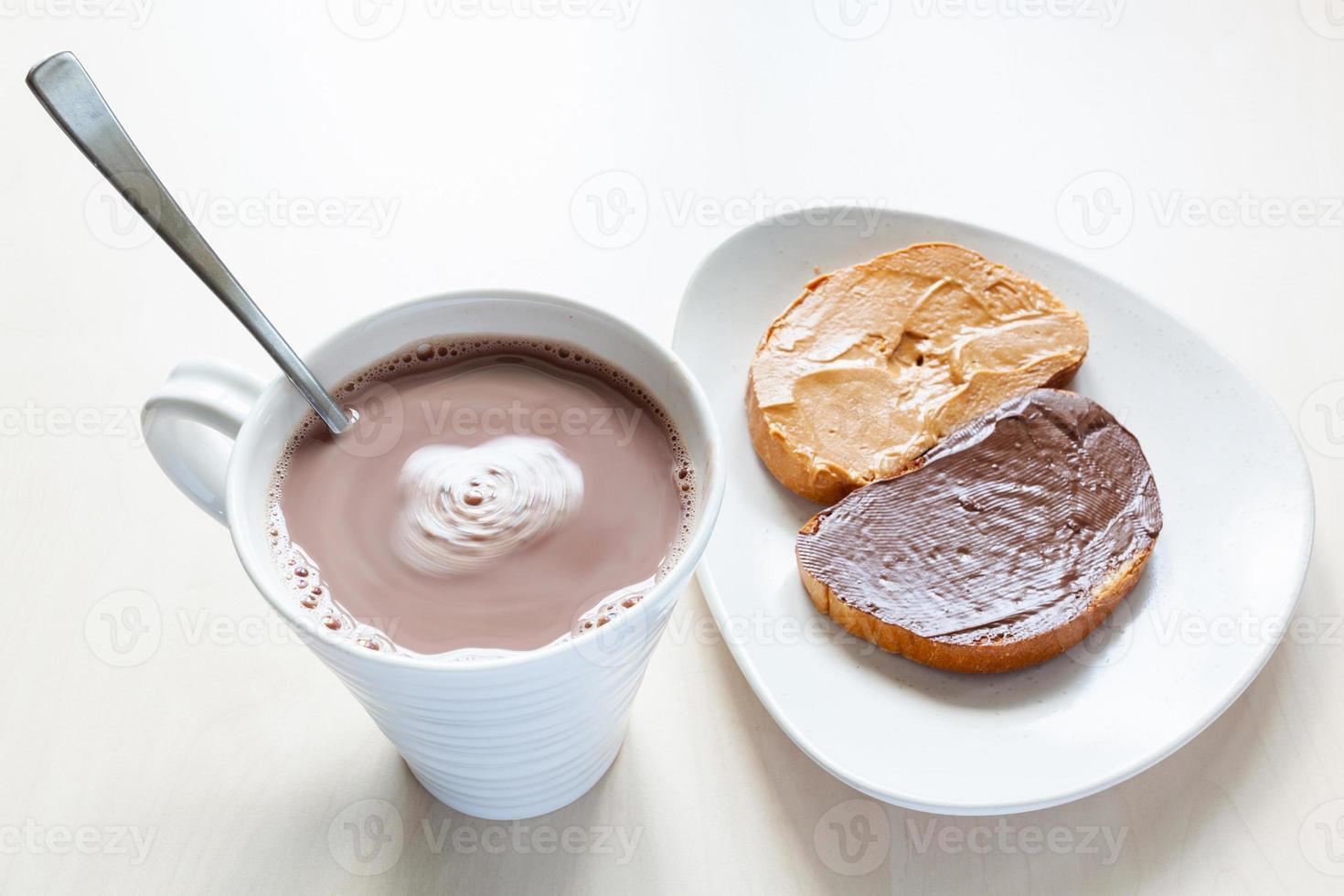 top view of mug with hot chocolate and toasts photo