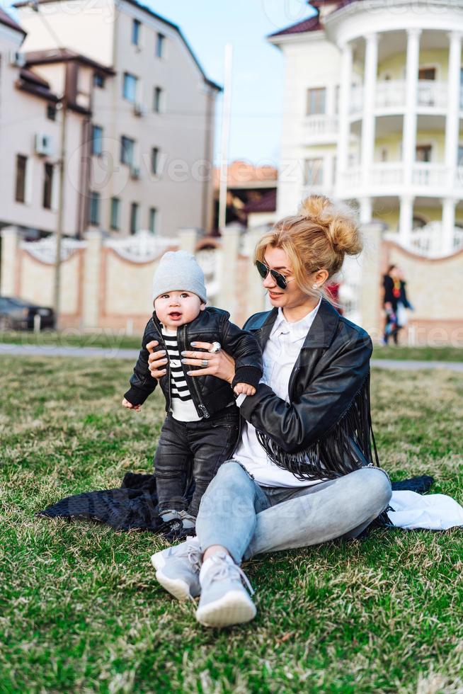 Young girl and child on green gras photo