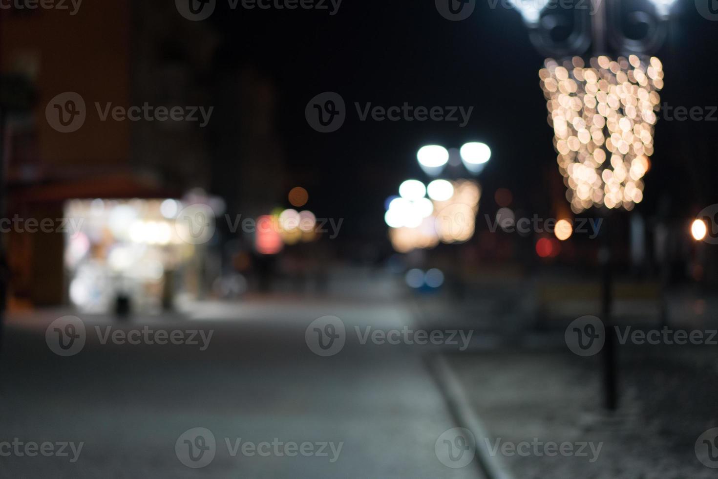 Night city street lights bokeh background photo