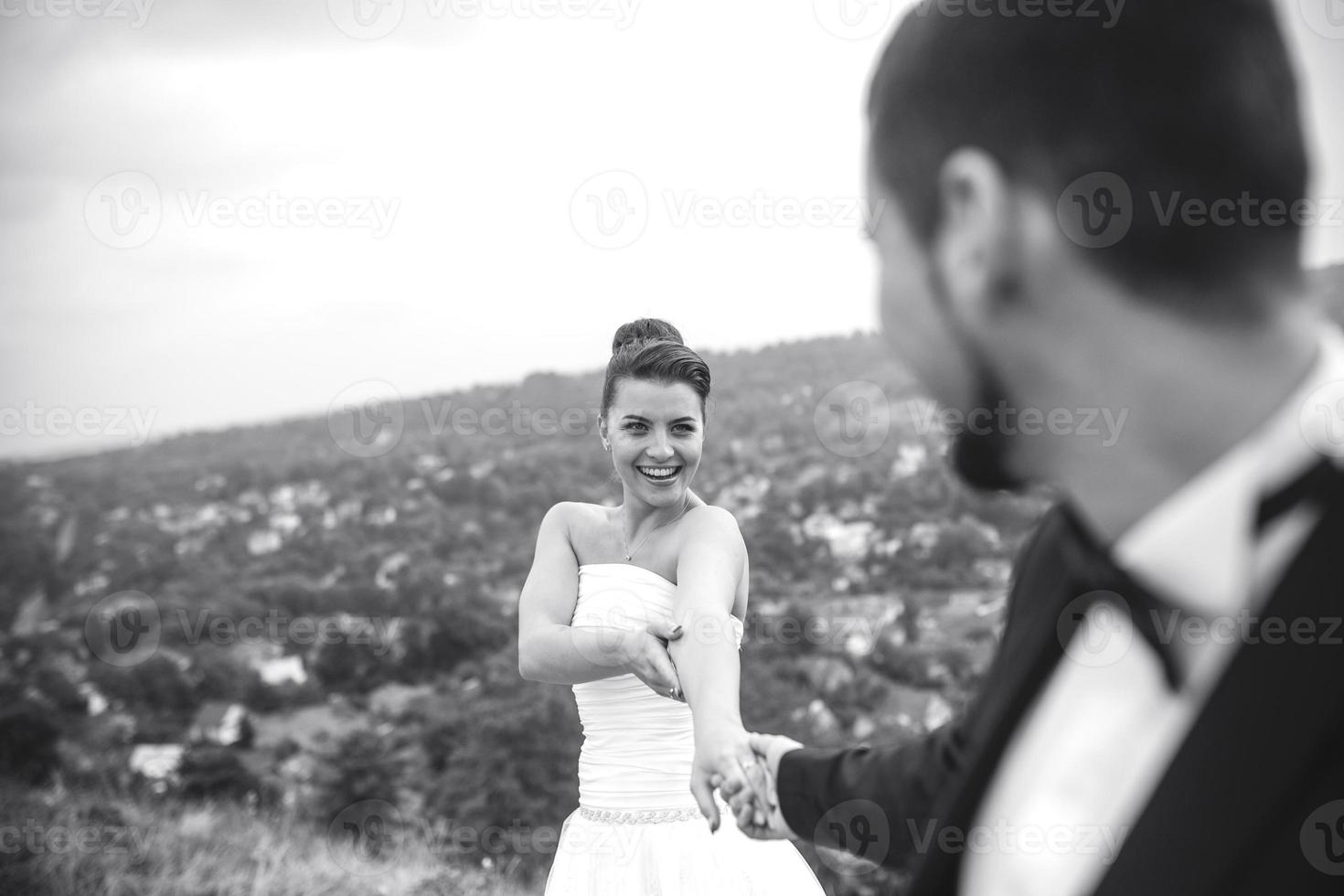 Wedding couple posing for the camera photo