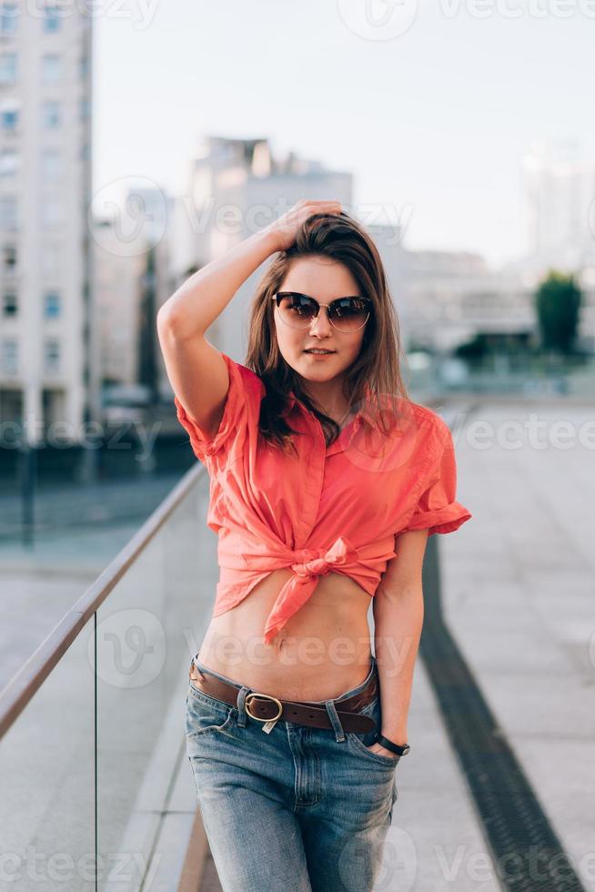 Young girl on the city street photo