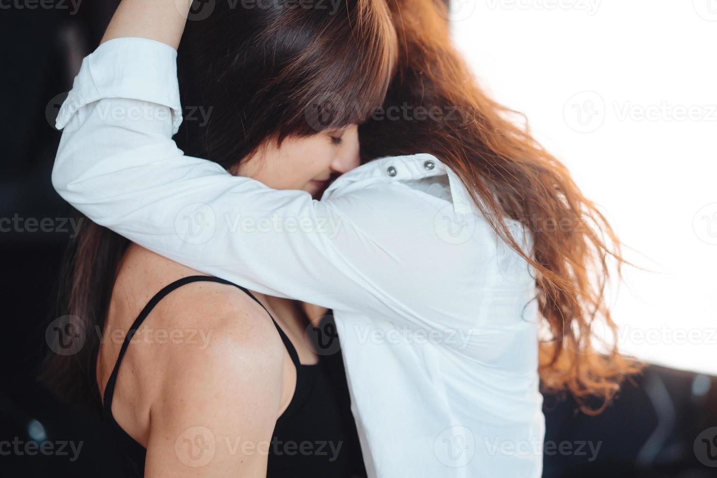 Two girls in each other's tender embraces photo
