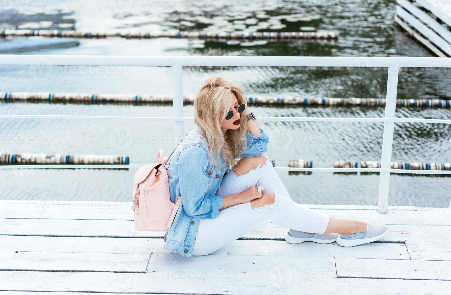 Blonde woman with a bag photo