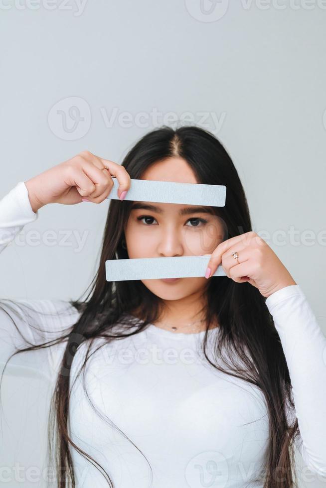Portrait of a pretty smiling woman posing isolated photo