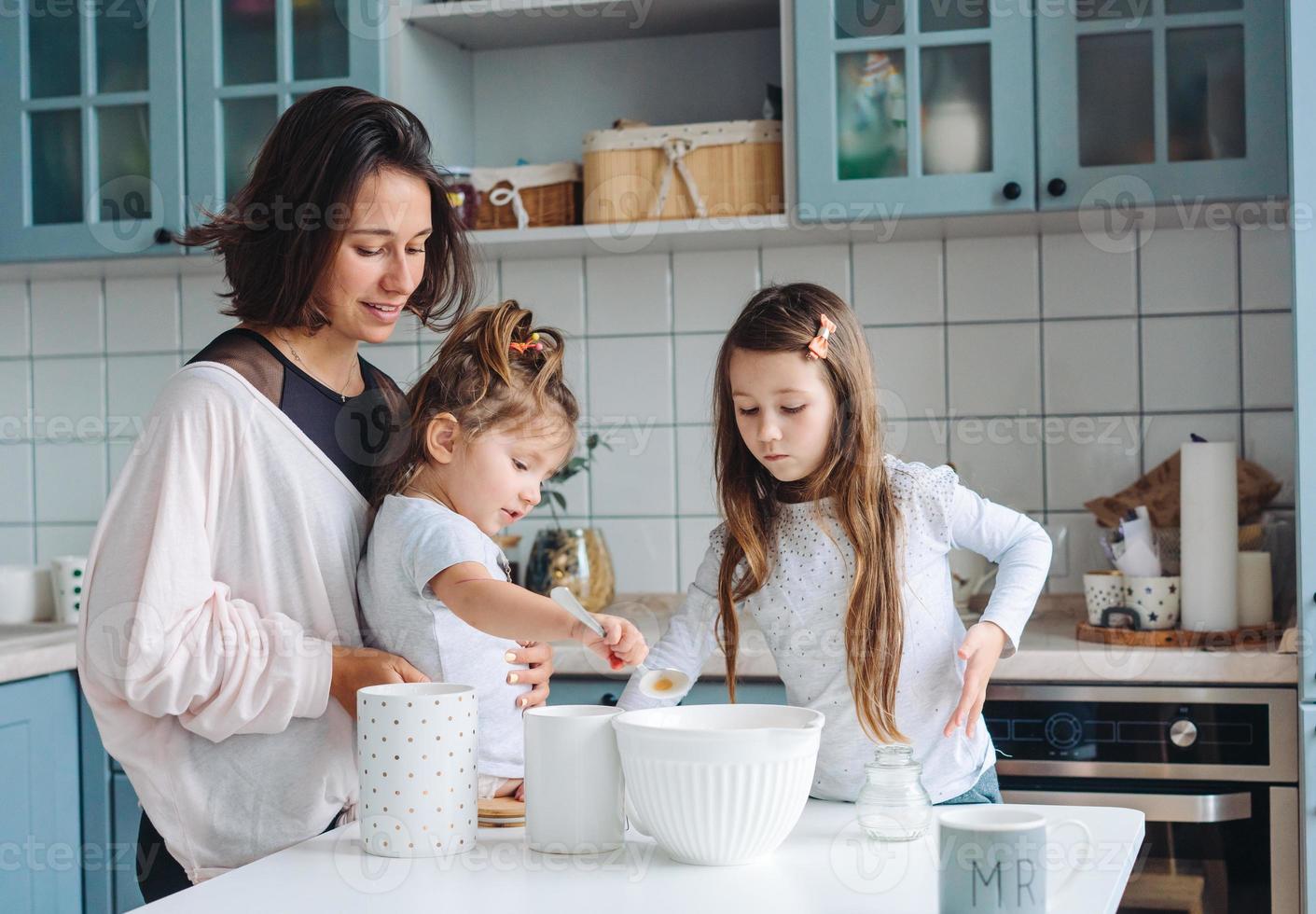 Happy family cook together in the kitchen photo