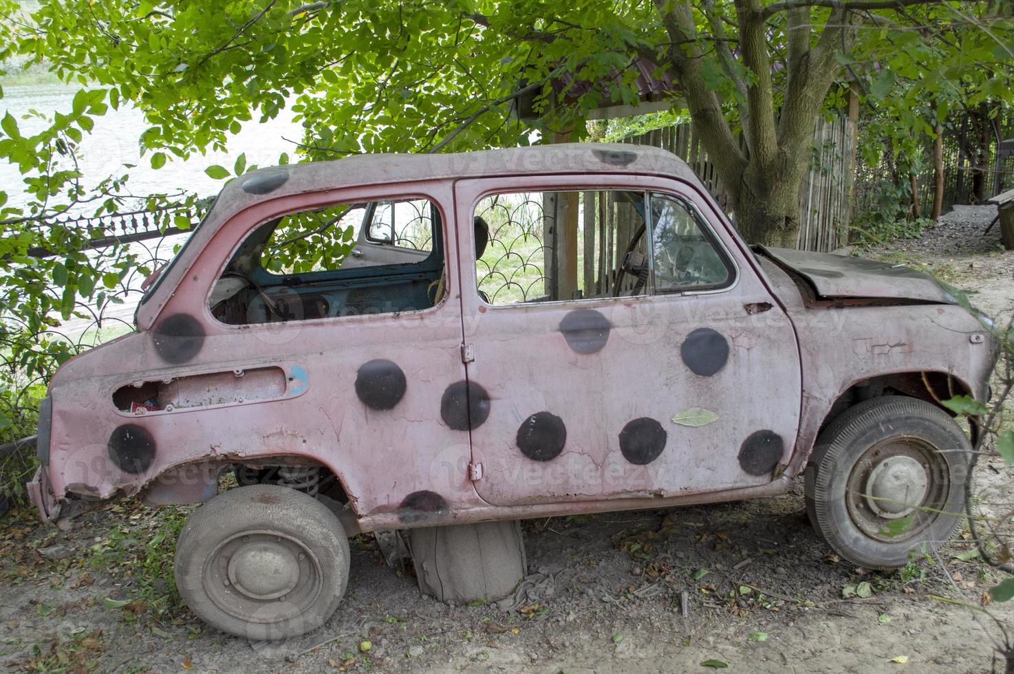 old rusty pink passenger car photo