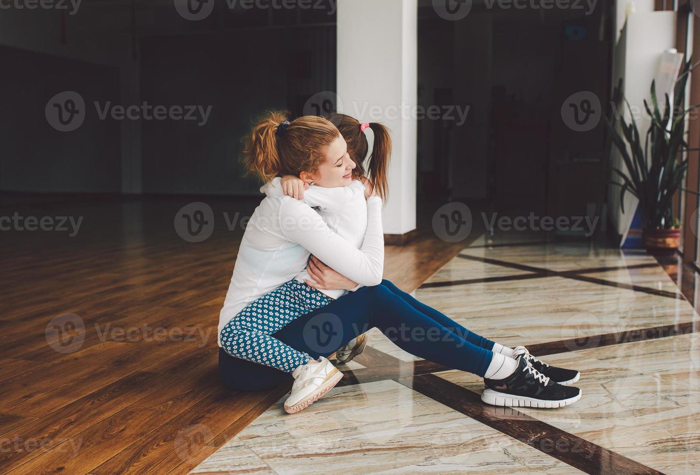 Charming family spends time in the gym photo