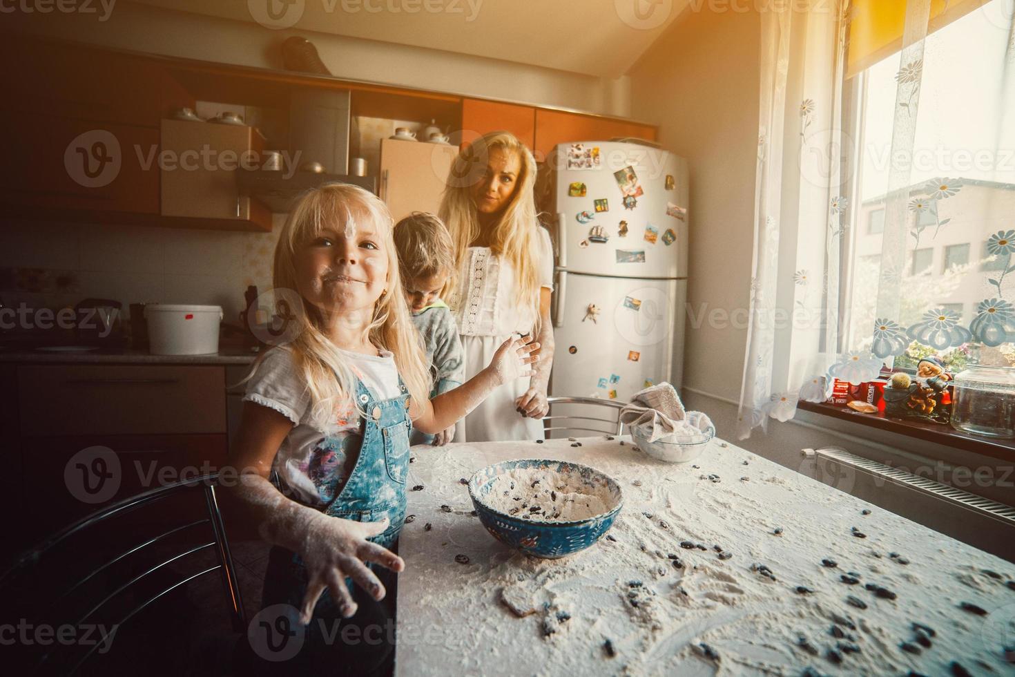mother and children playing photo