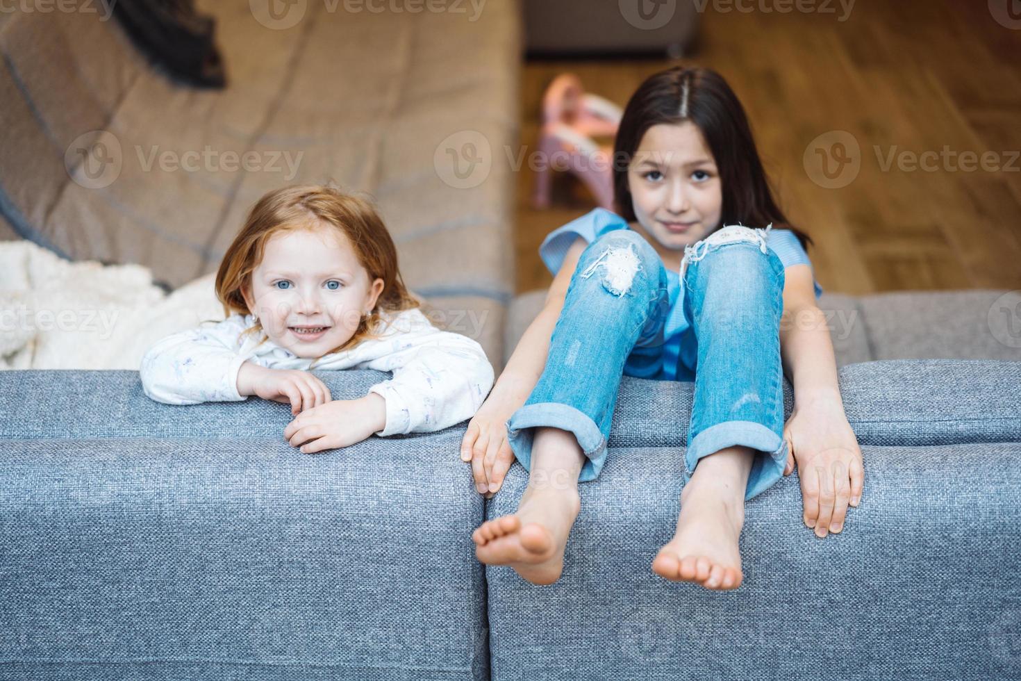 Elder and younger daughter on the big couch photo