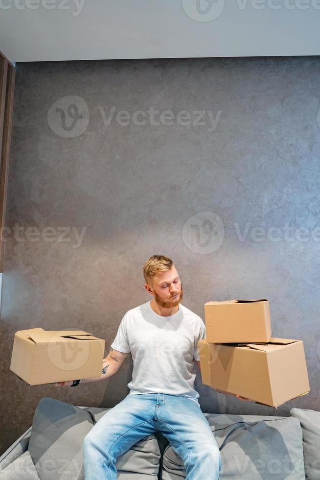 The guy is preparing a few boxes photo