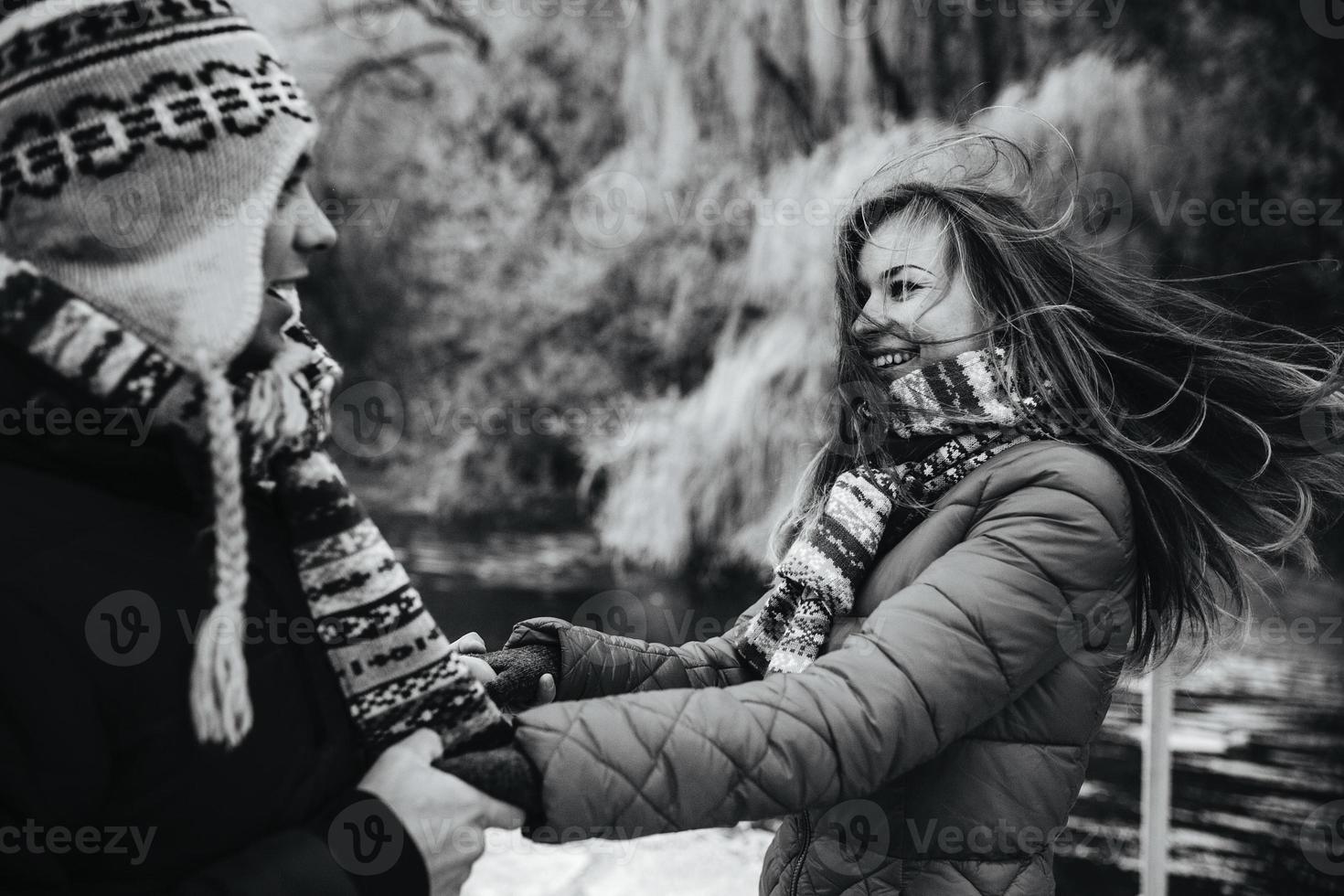 beautiful couple having fun on the pier photo