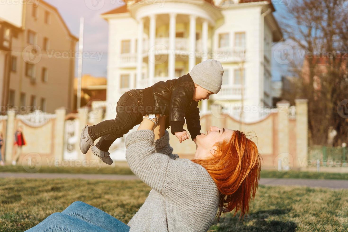Mother and son on the grass photo