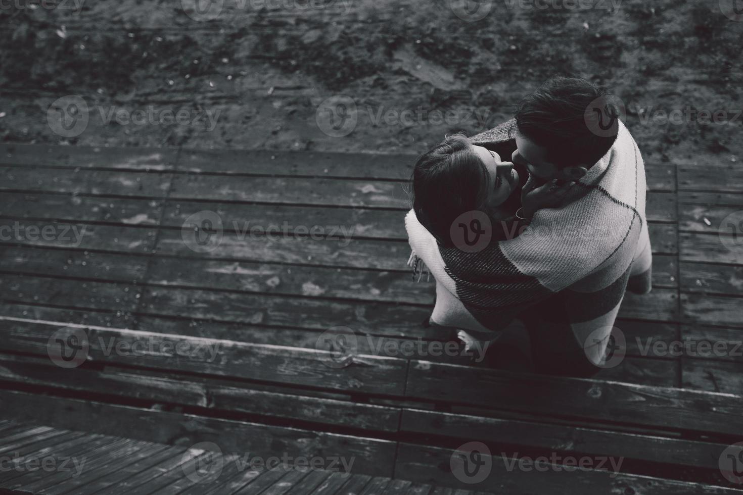 Young couple wrapped in plaid photo