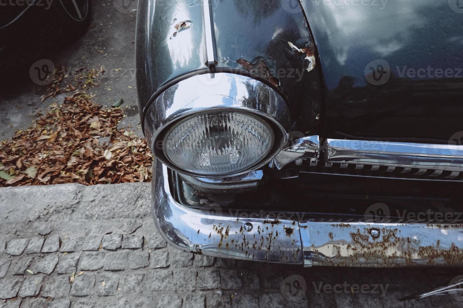 Front headlight of an old soviet automobile gas 21 photo