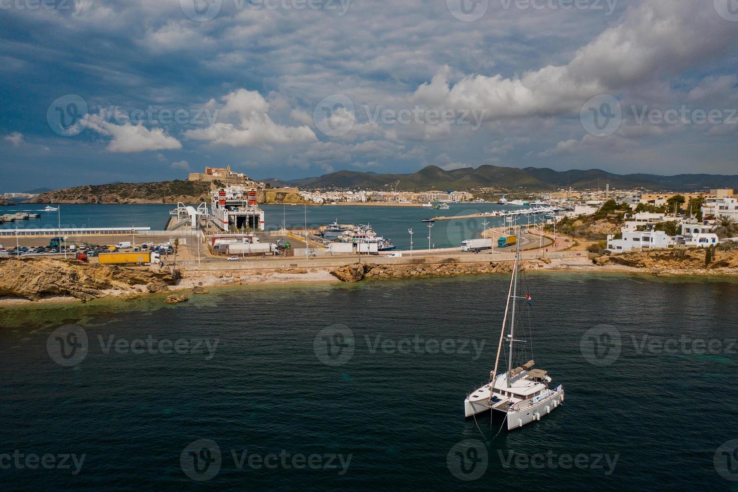 Aerial view on catamaran and port on the background. photo