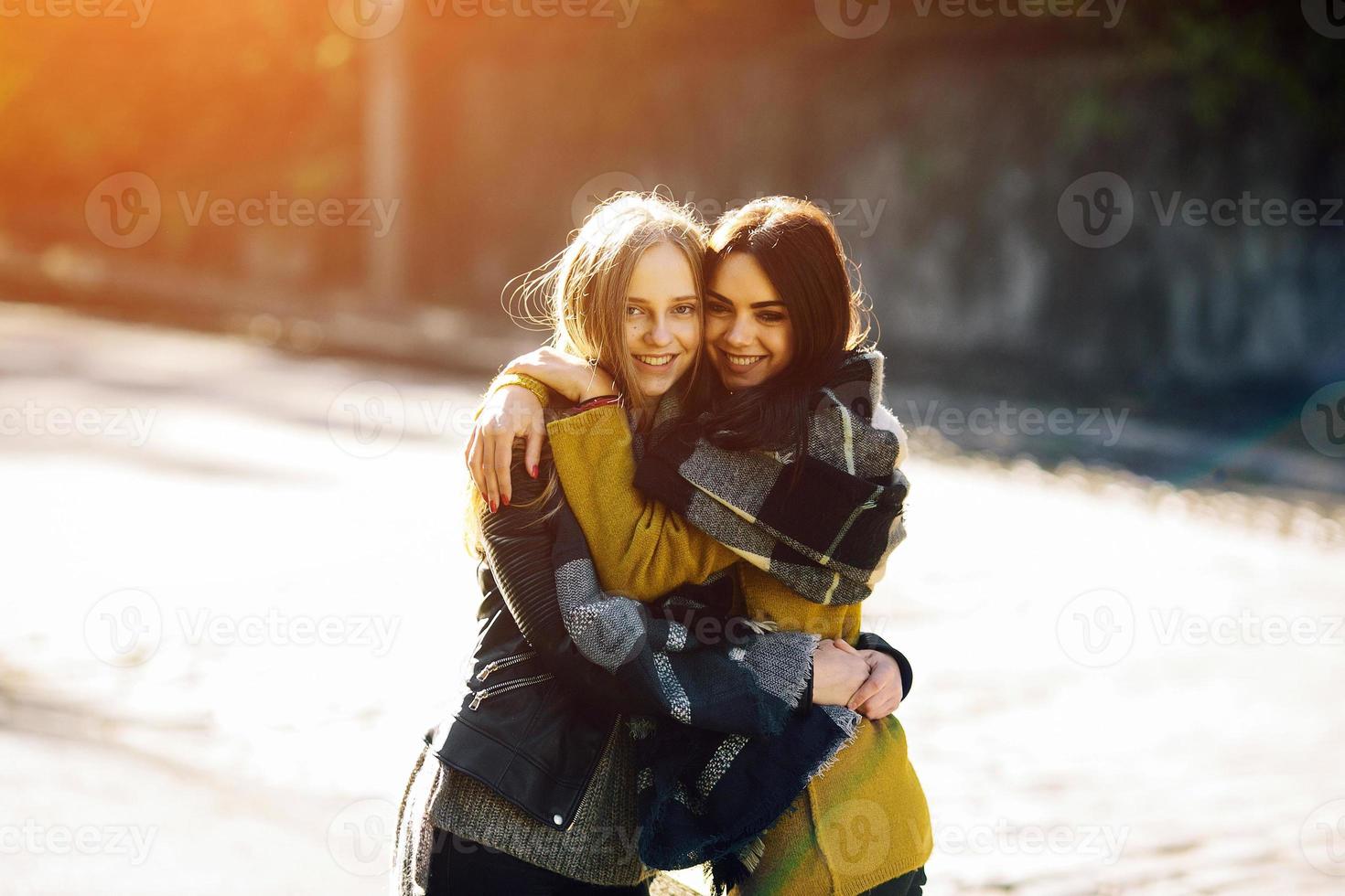 Fashion girls posing on the street photo