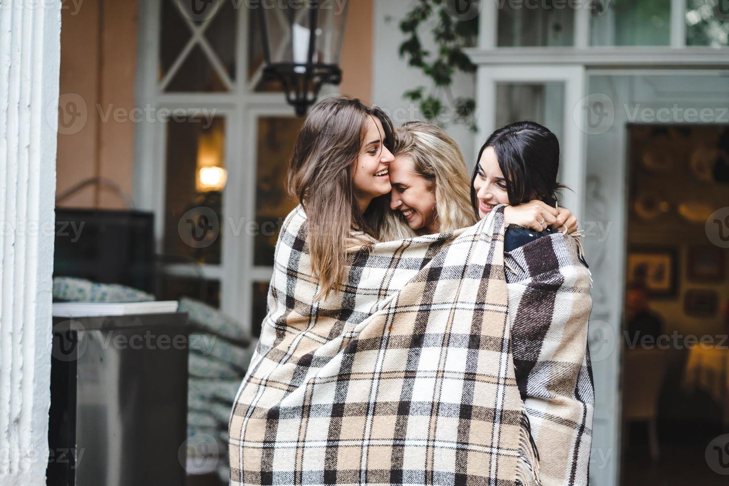 Three girlfriends on the veranda photo