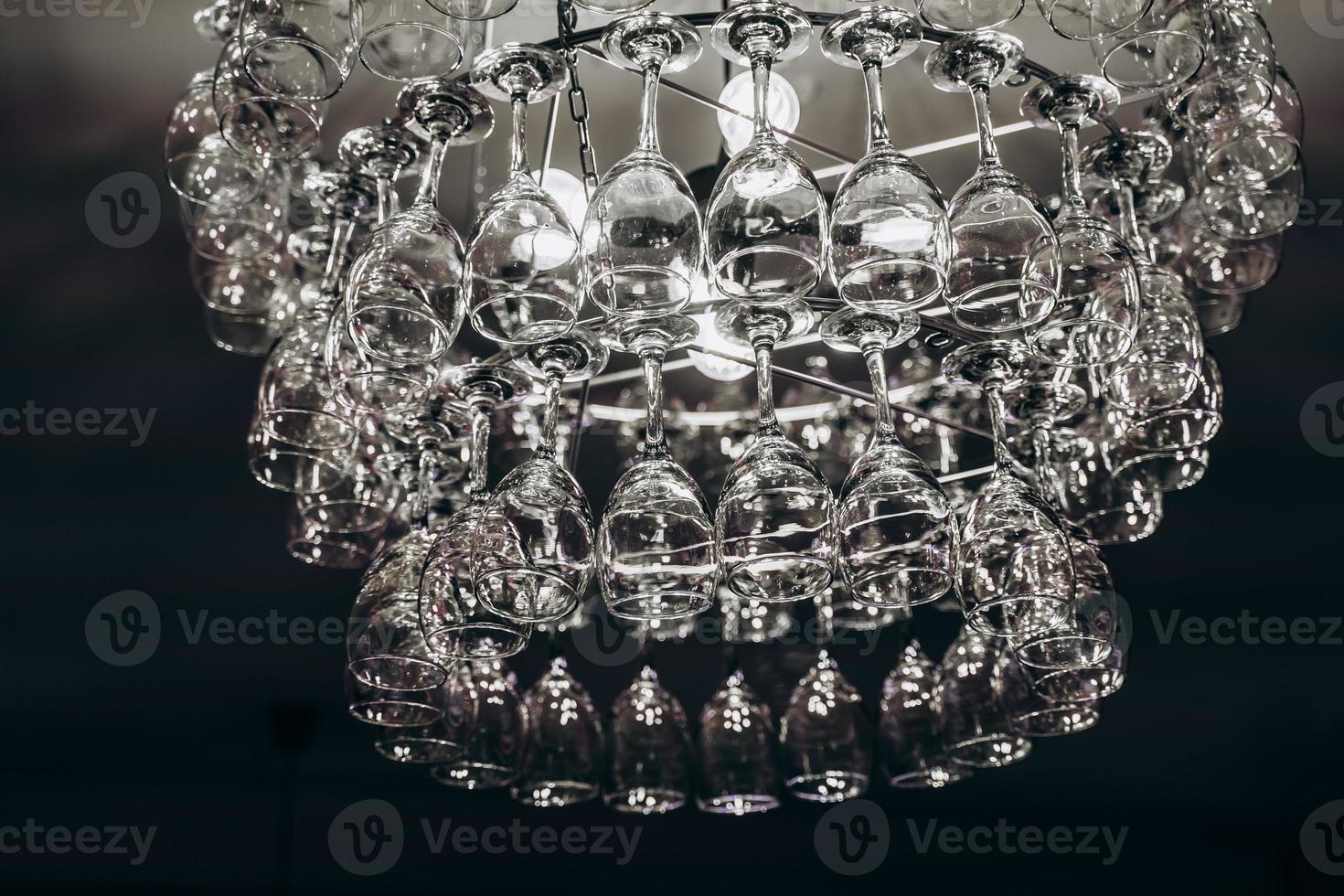 Beautiful chandelier made with glasses of wine photo