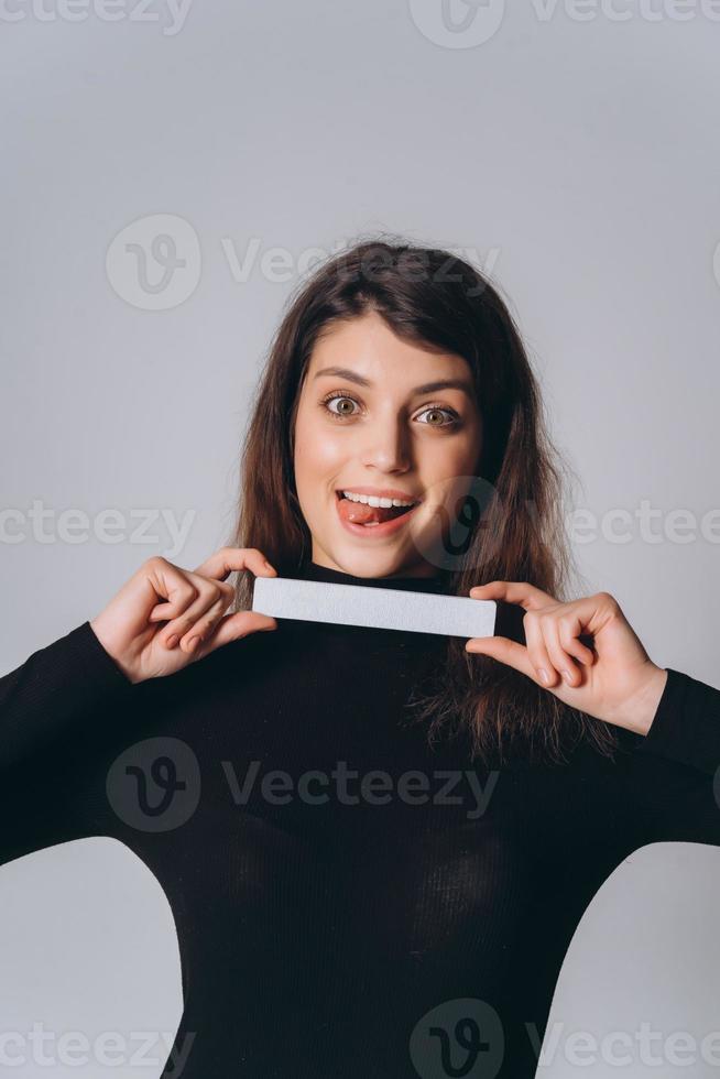 Portrait of a pretty smiling woman posing isolated photo