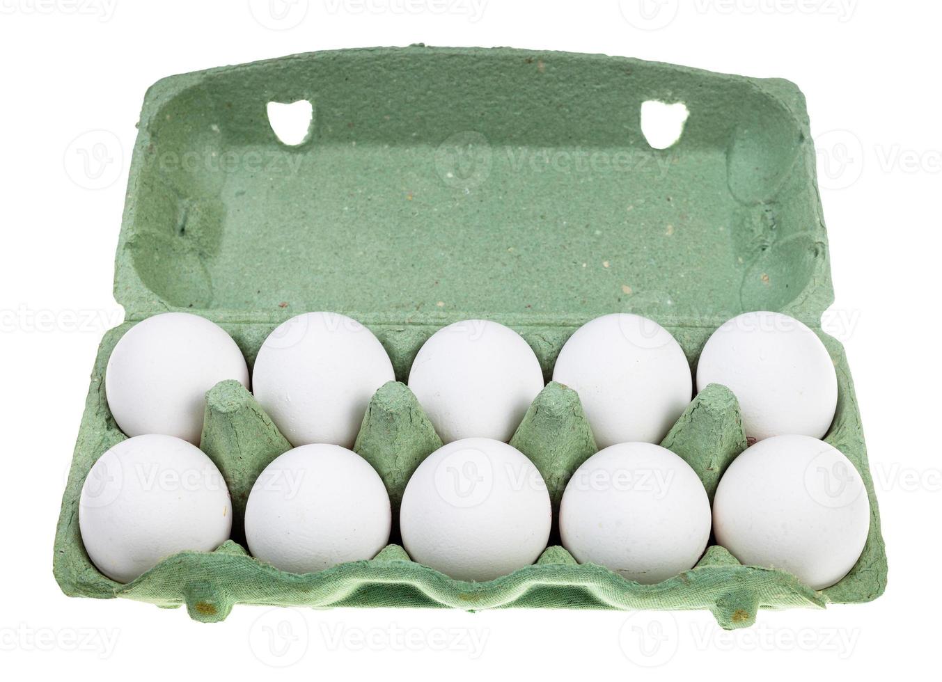 ten white chicken eggs in green container isolated photo