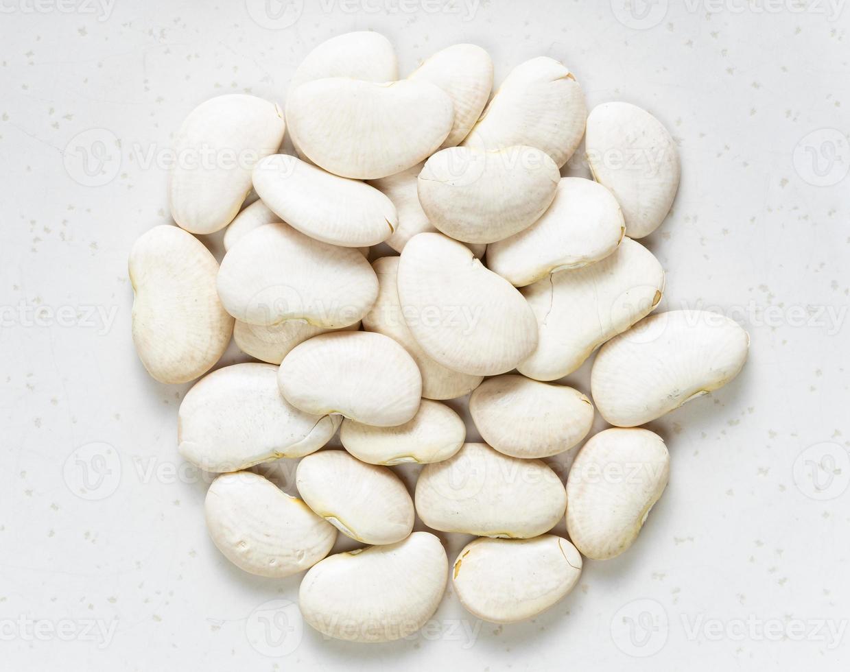 pile of raw lima beans close up on gray photo