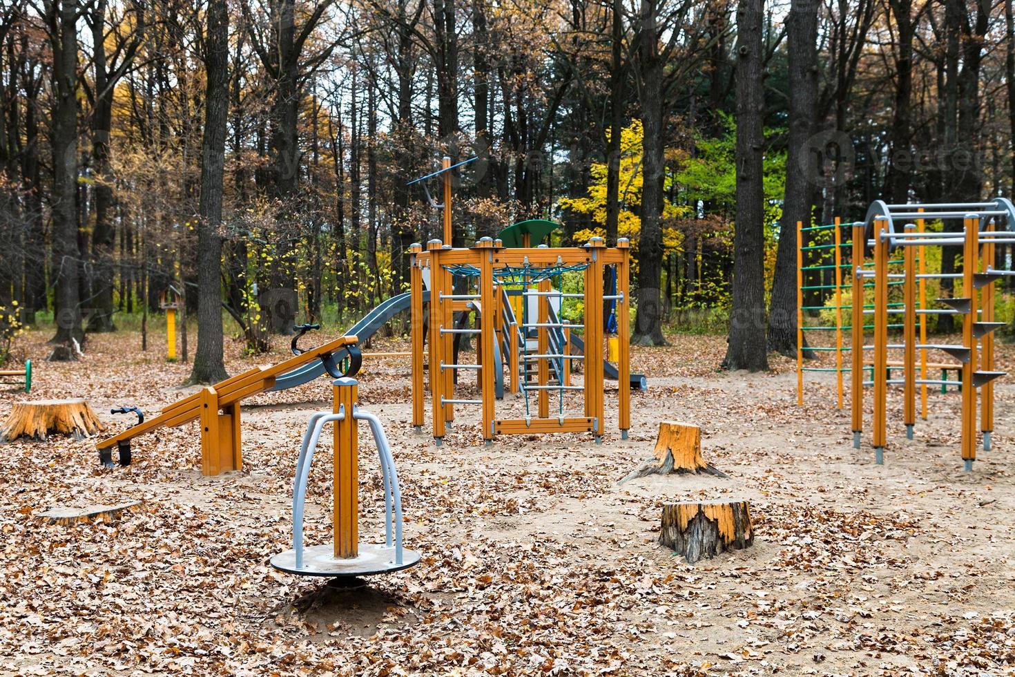 playground in urban park in autumn photo