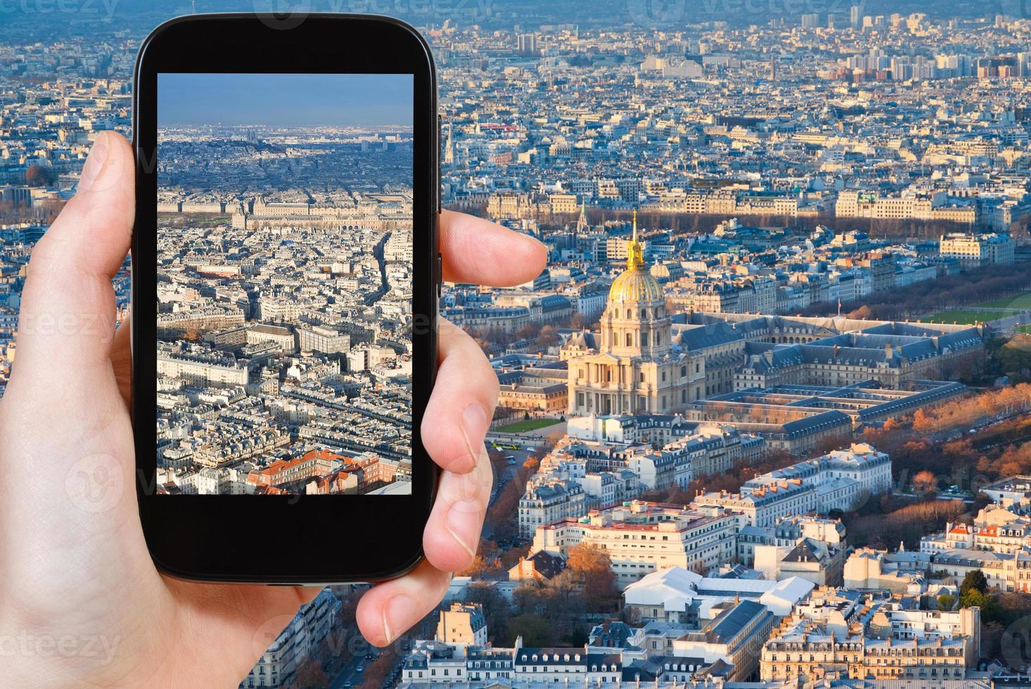 tourist taking photo of Paris panorama