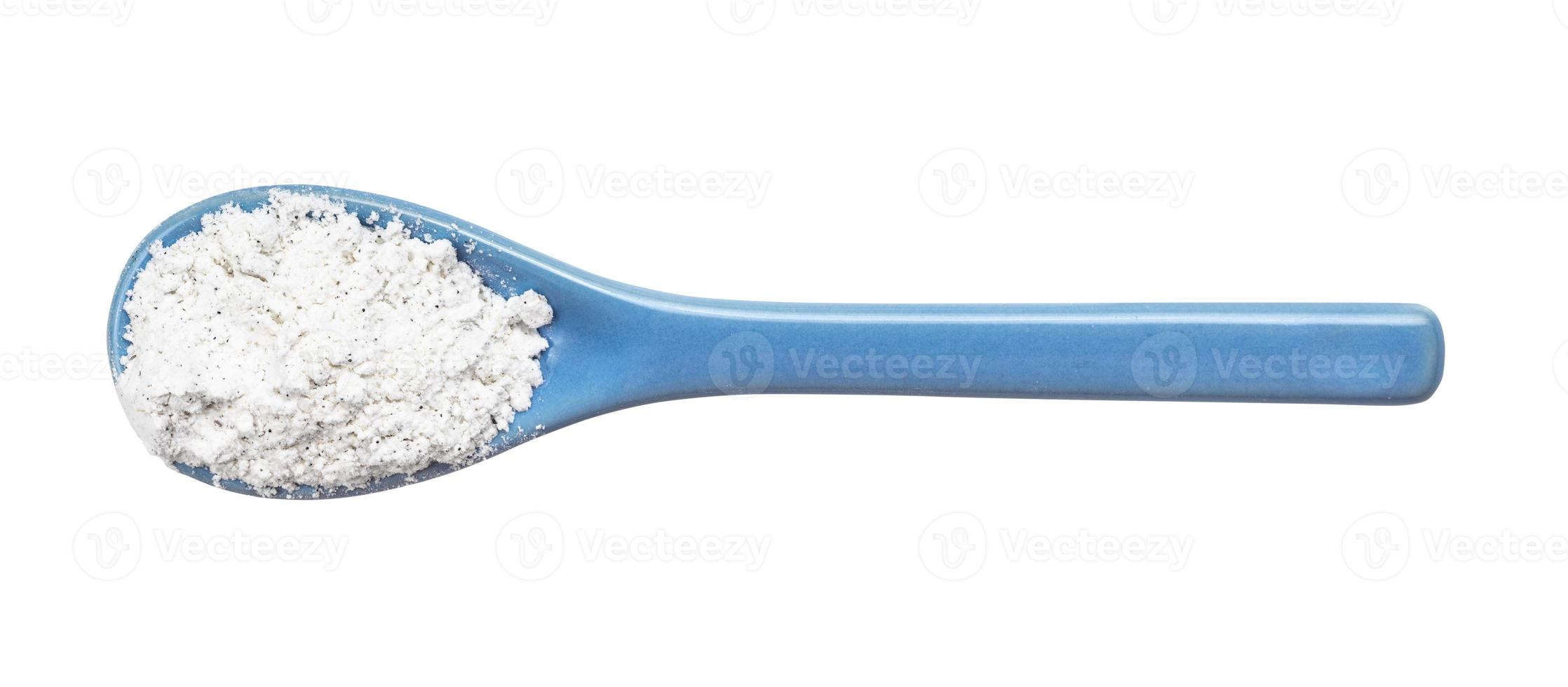 view of vanilla sugar in ceramic spoon isolated photo