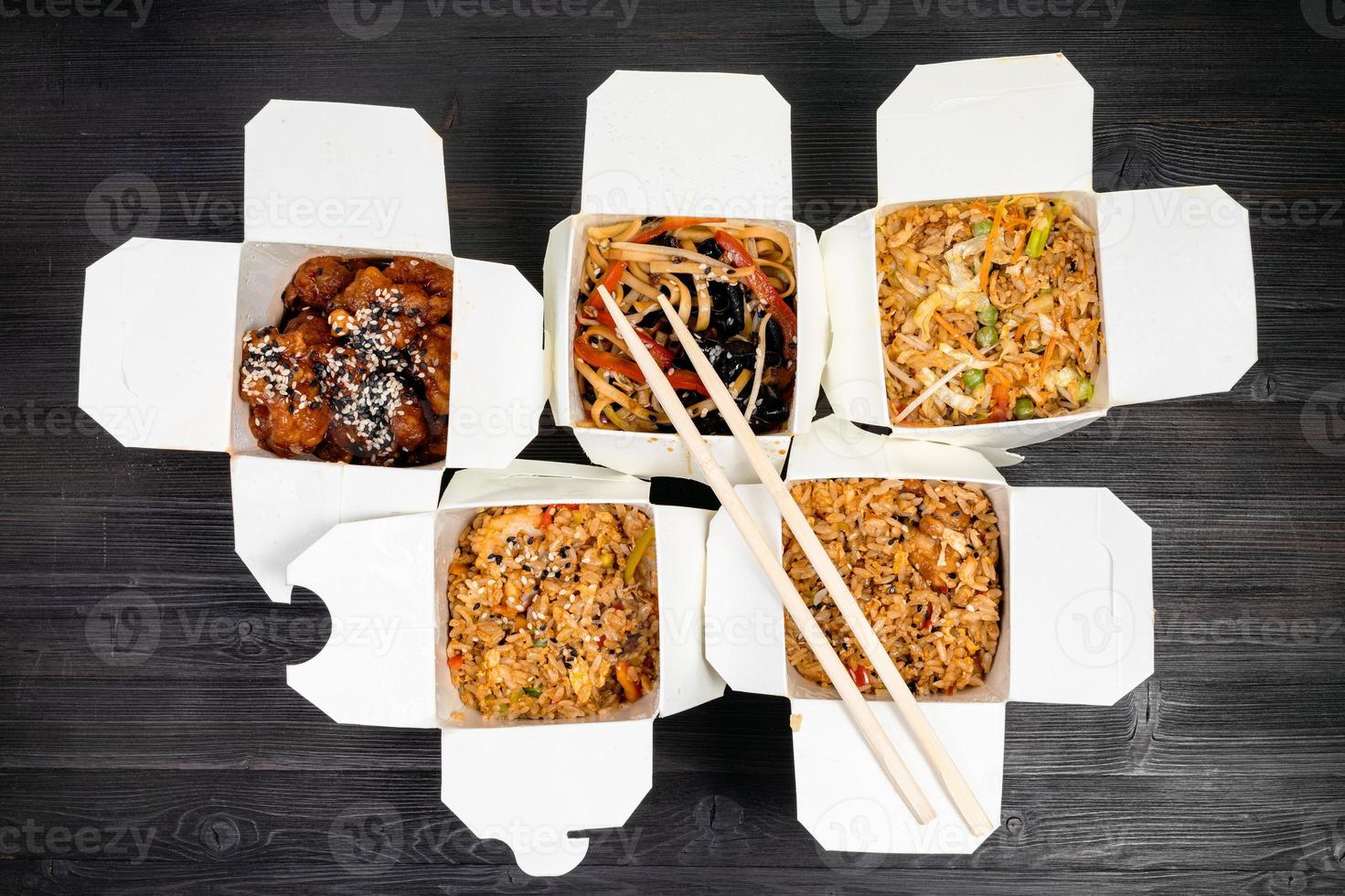 top view of chinese fast food in disposable boxes photo