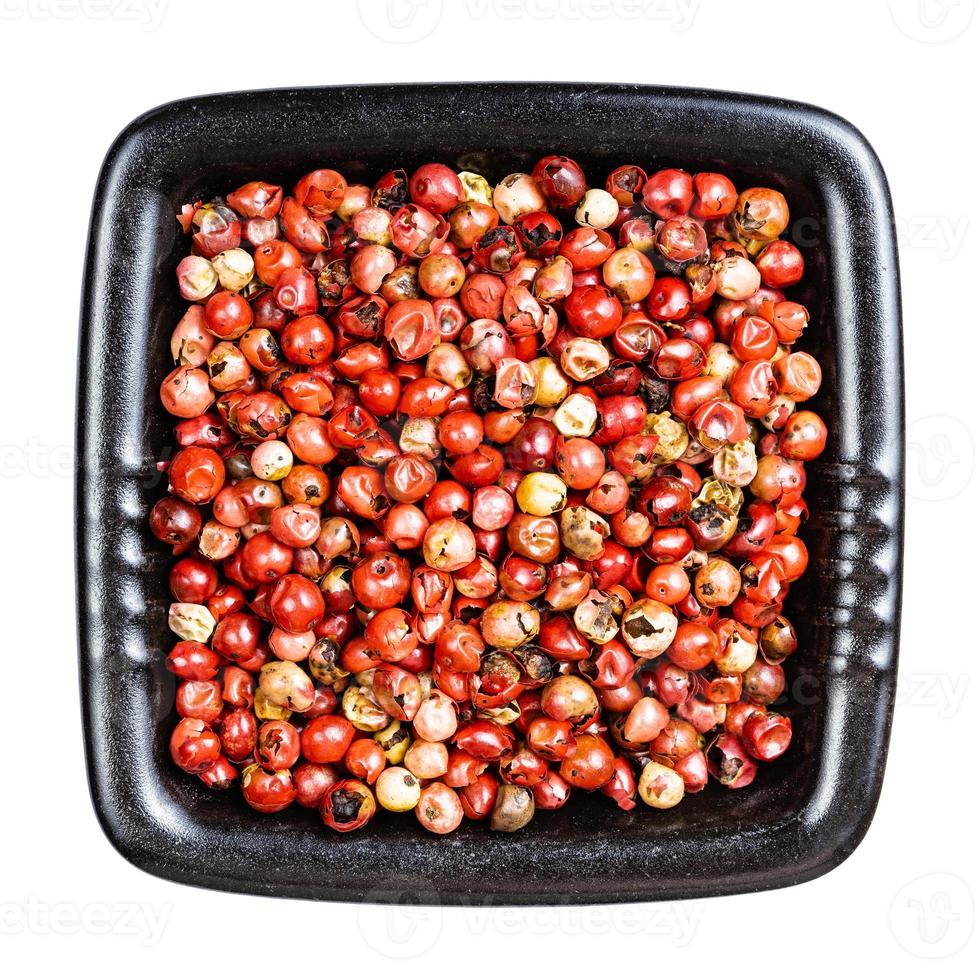 pink peppercorns Baie rose in bowl isolated photo