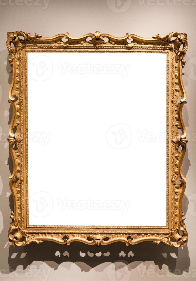 vertical old baroque painting frame on wall photo