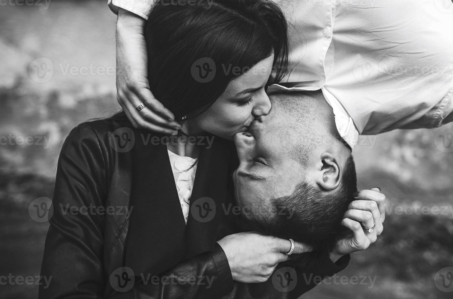 Couple kiss up side down photo