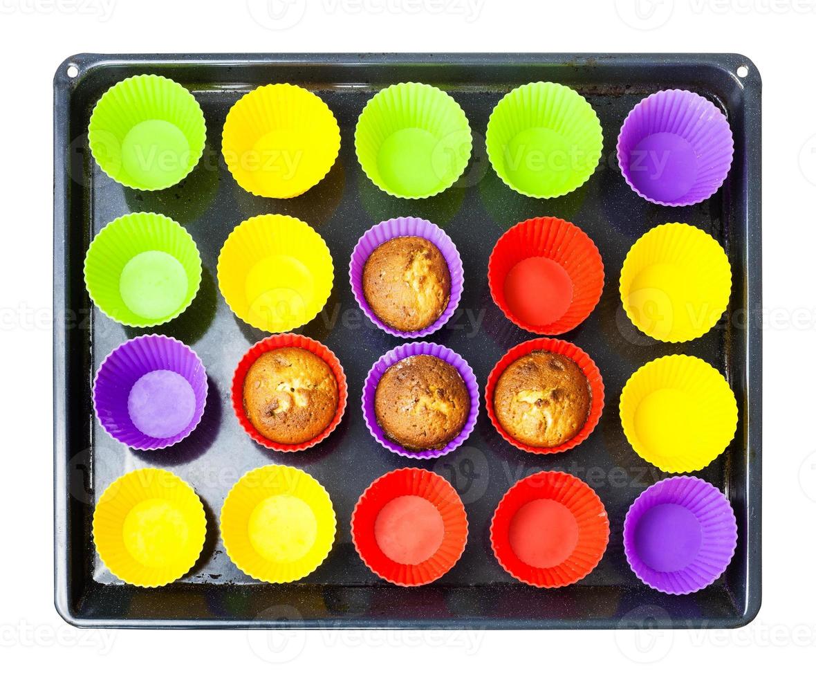 top view of tray with few baked cupcakes in molds photo