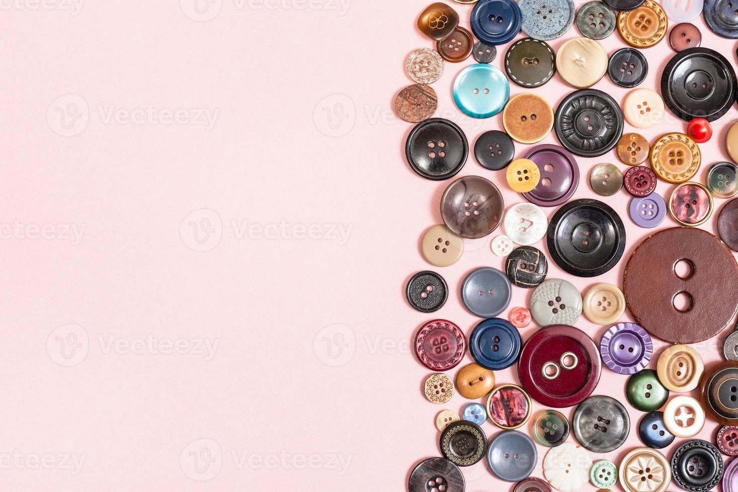 various buttons on pink background with copyspace photo