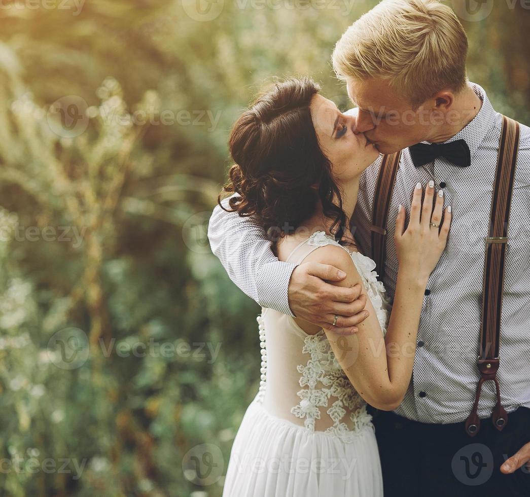 bride and groom kissing photo