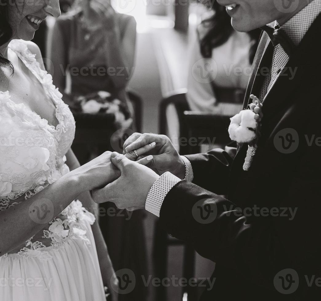 Putting the wedding ring on photo