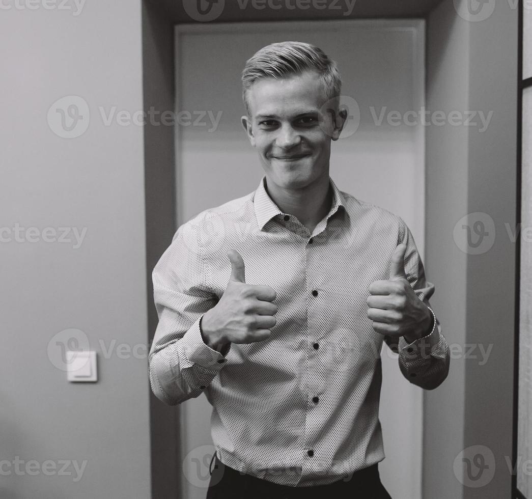 groom in the morning getting ready photo