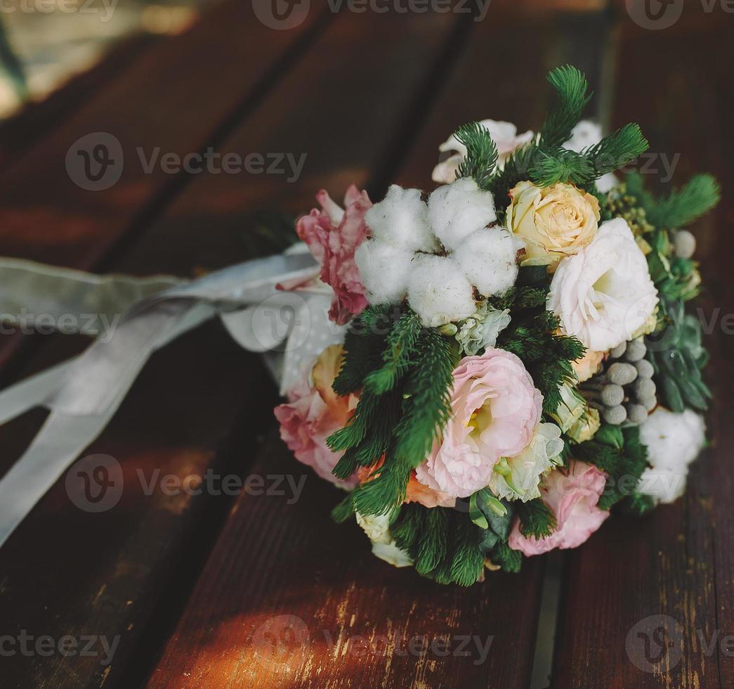 Wedding bouquet on a bench photo