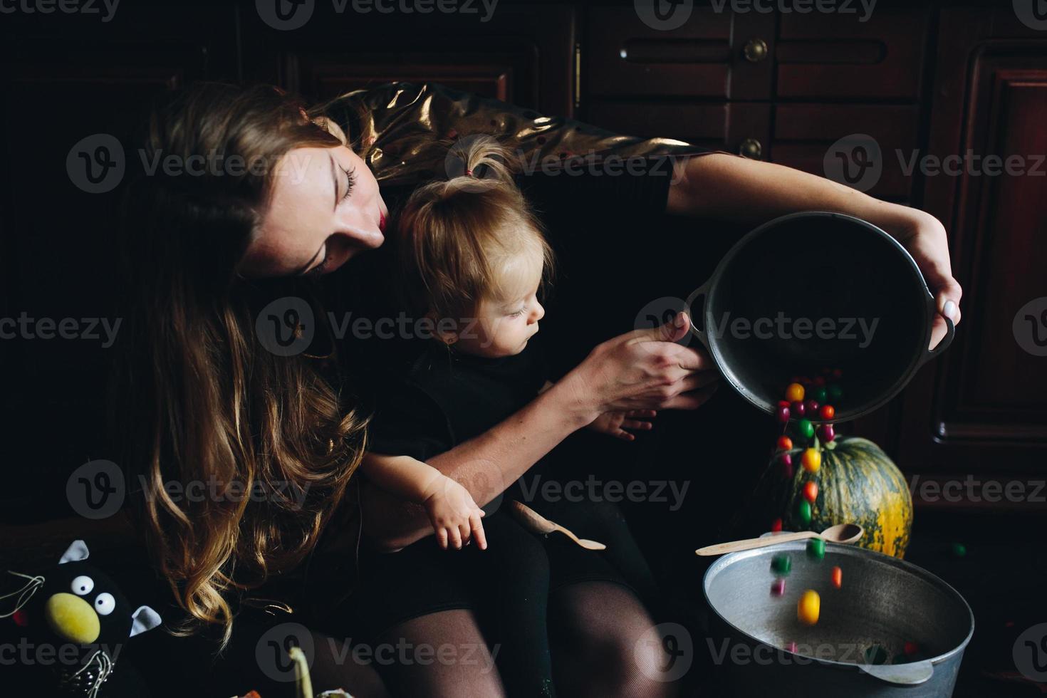 mother and daughter playing together at home photo