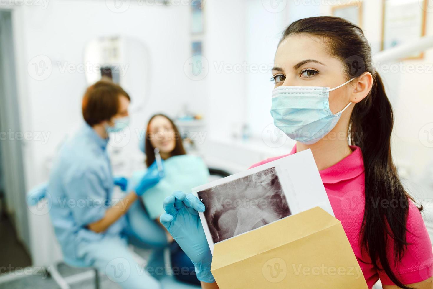Dentist with X-rays photo