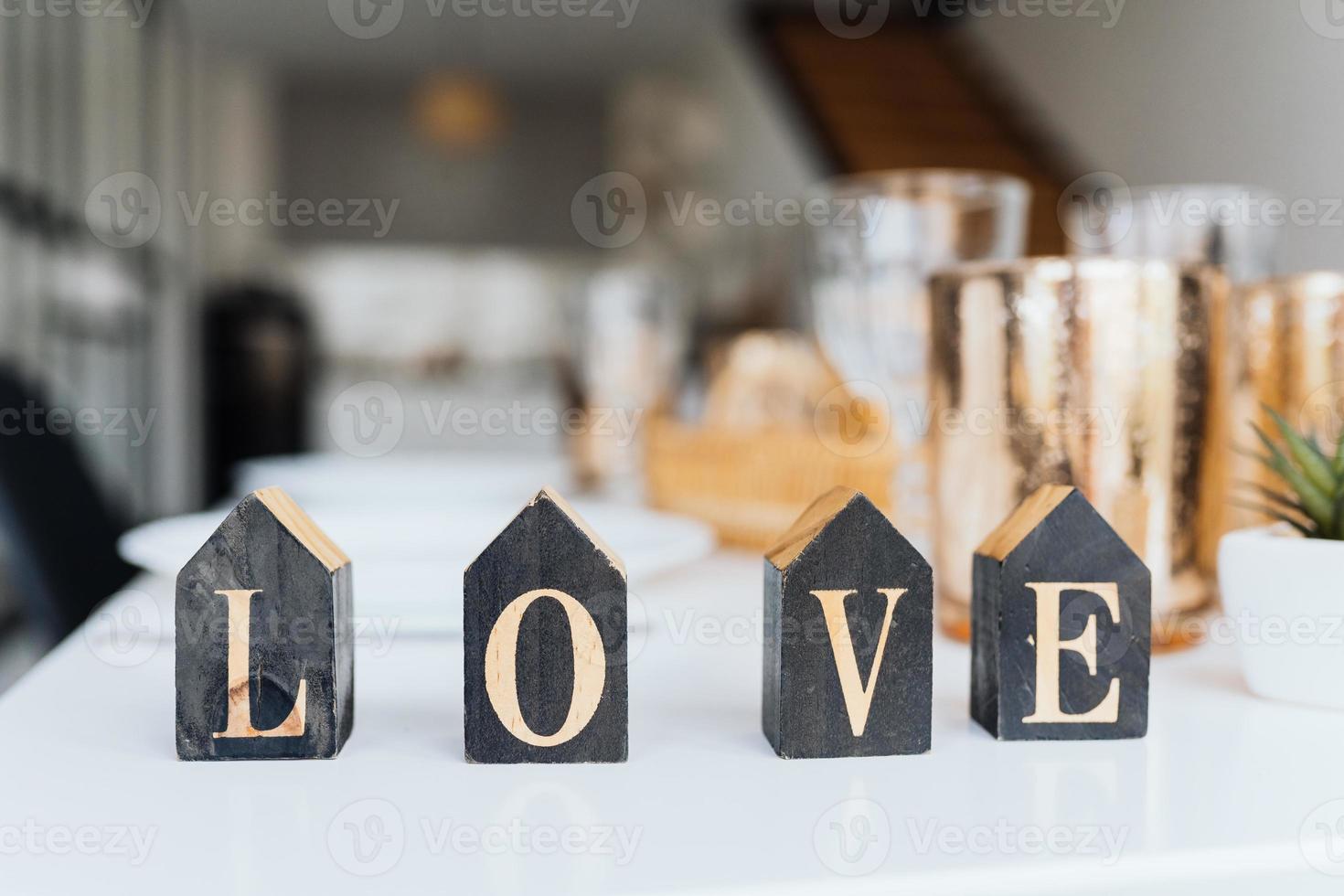 Word Love on wooden cubes, close-up. Valentine concept photo