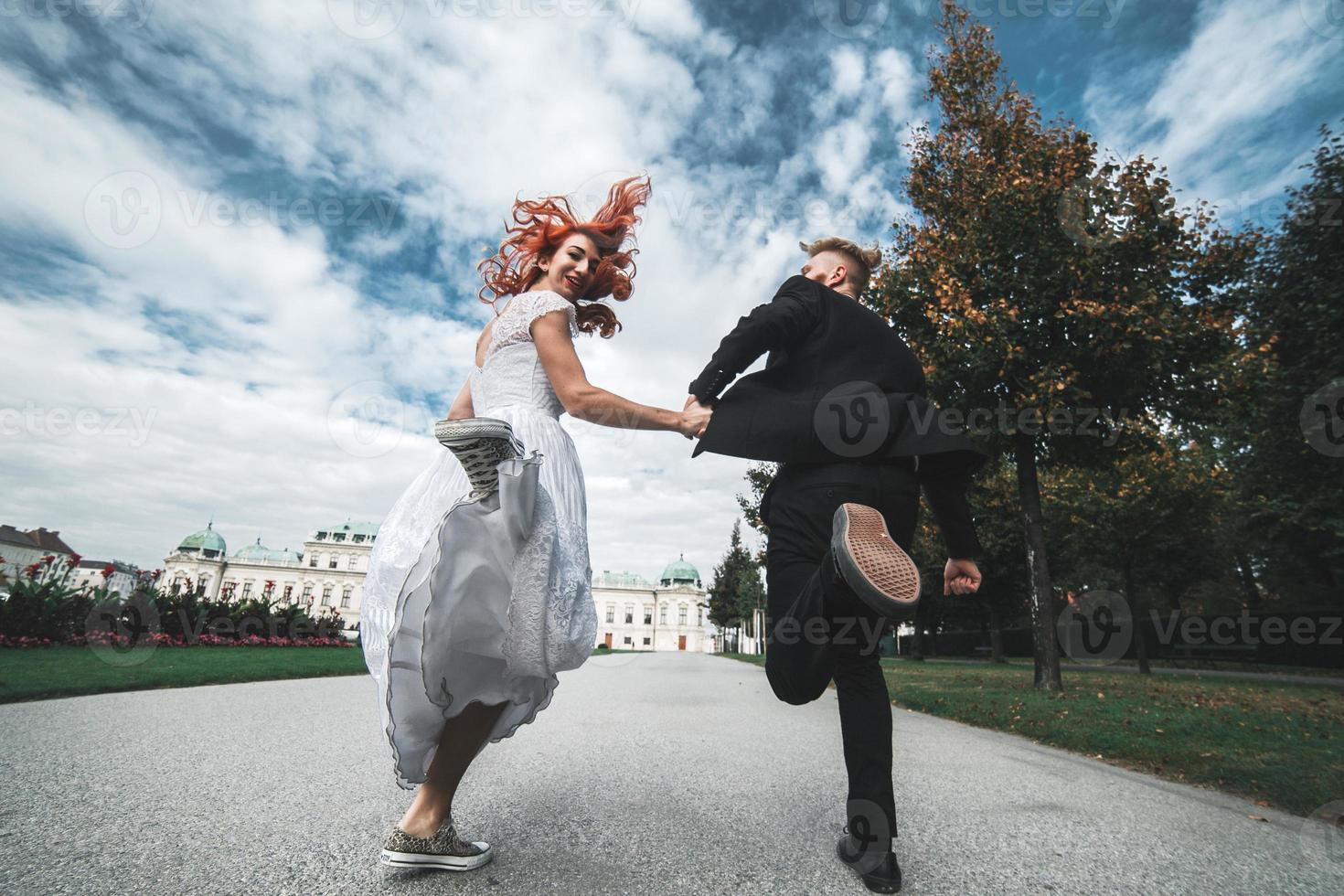 Wedding couple on a walk in the estate of the Belvedere in Vienna photo