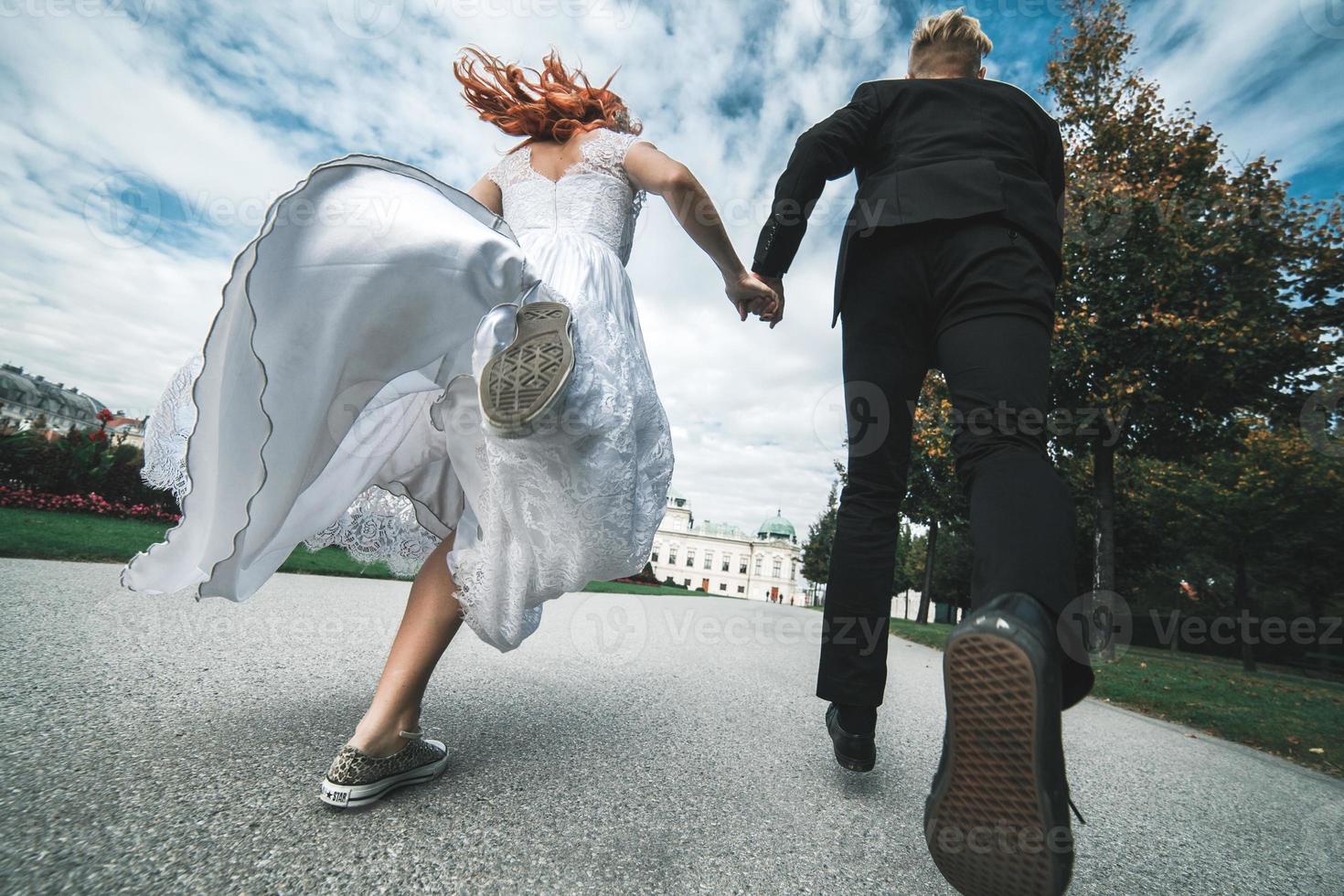 Wedding couple on a walk in the estate of the Belvedere in Vienna photo