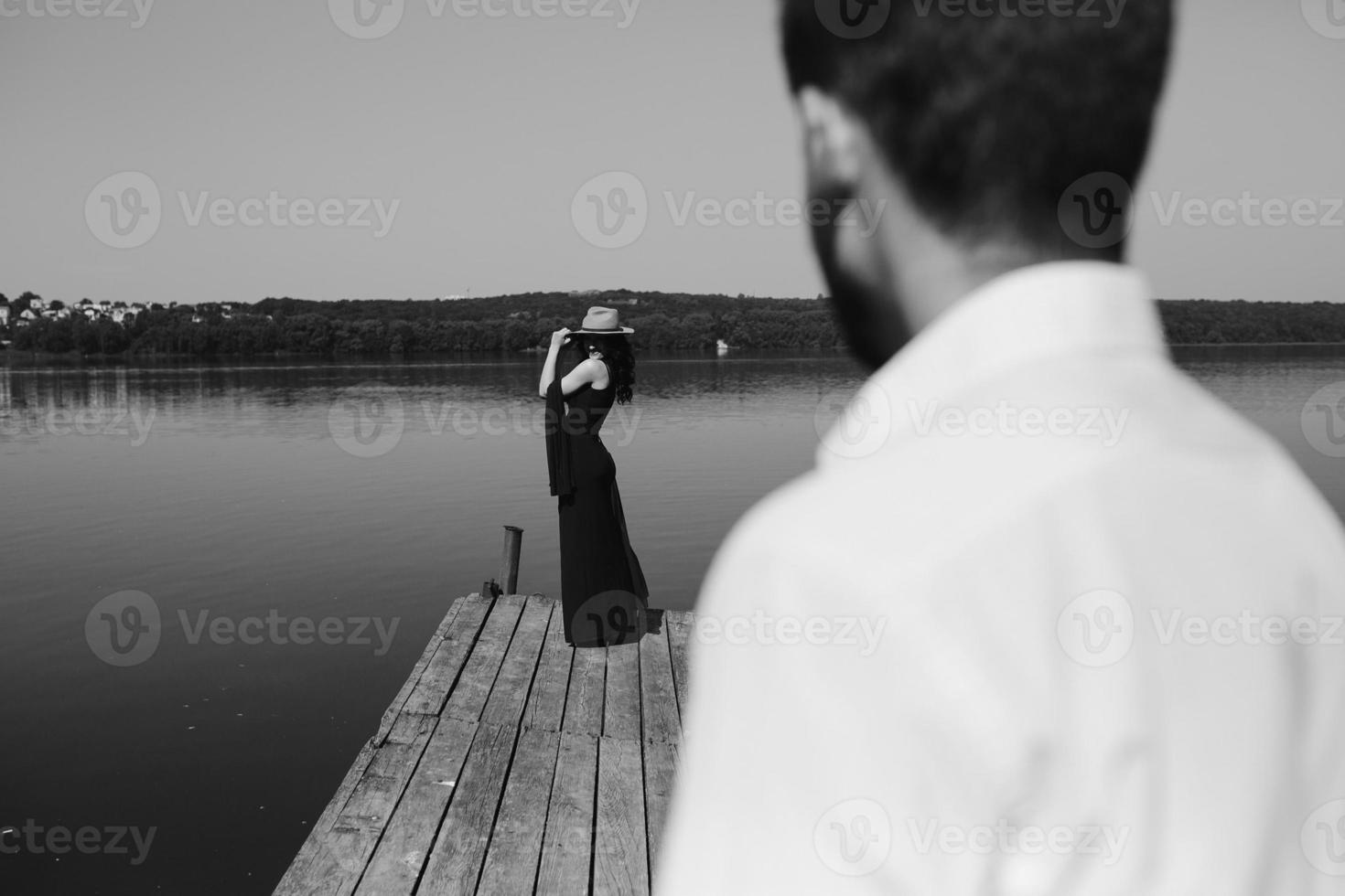 couple spends time on the wooden pier photo