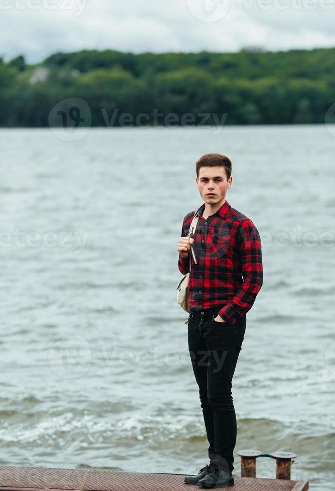 man standing on a pier photo